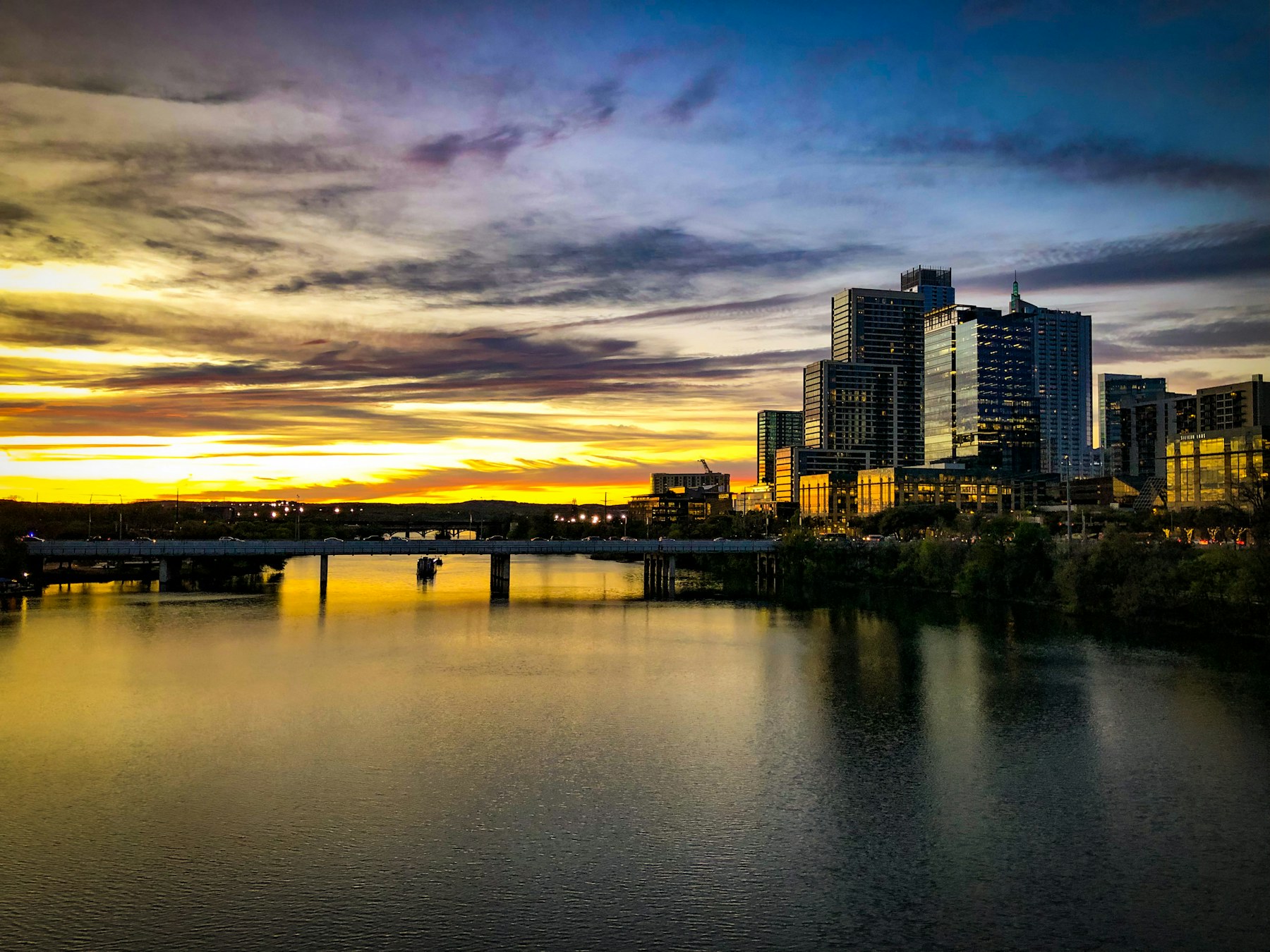 Austin skyline across Lady Bird Lake at sunset